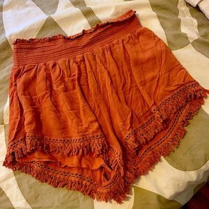 Orange Flowy tassel shorts